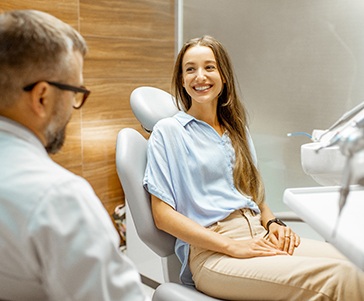 Lady smiles at dentist