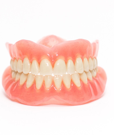 Complete set of dentures with white background