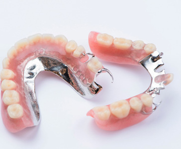 Bird’s eye view of partial dentures on white background