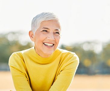 Woman smiling outdoors
