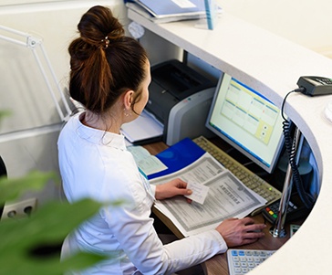 Receptionist working at a desk